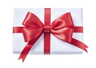 White wrapped gift box with red ribbon isolated on white