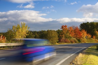 Speed car on a road in Krkonose mountain, Czech Republic, Europe