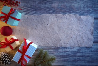 Christmas gifts and blank paper recycled background fir and cones