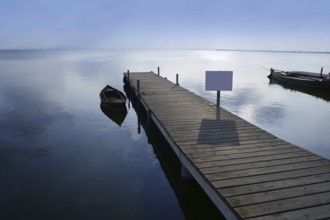 Albufera lake wetlands pier with boat in Valencia Spain