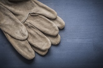 Working gloves on dark blue board