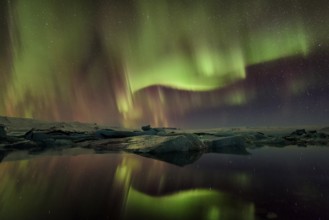 Northern lights aurora in Jokulsarlon glacial river lagoon
