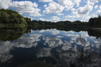 Old water with white clouds