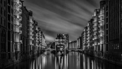 The moated castle in the Speicherstadt photographed from the Poggemühlen Bridge