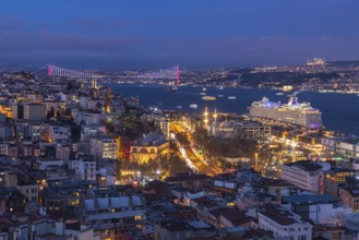 A picture of the buildings of the Beyoglu district and the Bosphorus strait at night