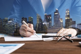 Investment manager analyze financial diagram at wooden desk. Close up woman hand with pen. Strategy