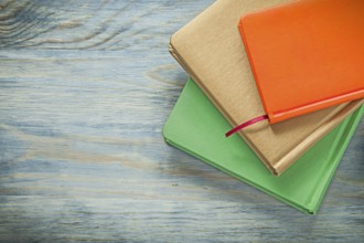 Set of notepads on wooden board education concept