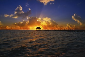 Holbox island sunset beach tropical hut pier in Mexico