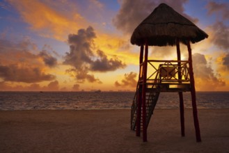 Isla Mujeres island Caribbean beach sunset baywatch tower Riviera Maya Mexico