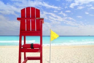 Baywatch red beach seat yellow wind flag in tropical caribbean sea