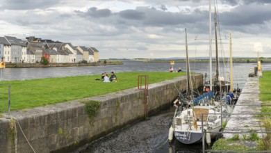 Boat anchored in Eglinton Canal Sea Lock, The Long Walk, Galway, Ireland, United Kingdom, Europe