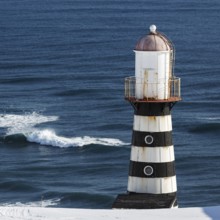 Lighthouse on coast of Pacific Ocean. Russia, Far East, Kamchatka Peninsula,