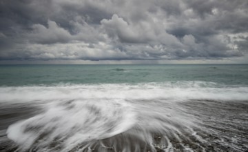 Windy waves crashing on a coast on a stormy day in winter. Paphos Cyprus