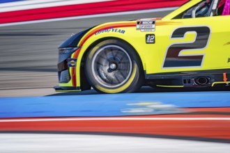 NASCAR Cup Series driver, AUSTIN CINDRIC (2), races through the turns during a practice session for