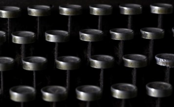 Keyboard of a vintage typewriter in close up, frontal view