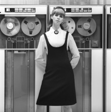 In the 1960s. Fashion model wearing the typical clothes of 1965. The photograph is taken in a 1960s