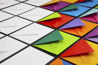 Composition with white and colored envelopes on the table. The photo suitable for various holidays