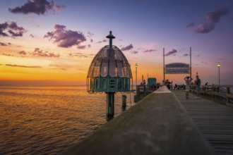 The Zinnowitz pier with diving bell in summer shortly after sunset