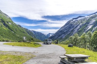 An idyllic valley in Strynefjell in Middle Norway in summertime with mountains and stream.A