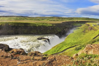 Enormous waterfall Gyullfoss. Water abyss. Summer in Iceland