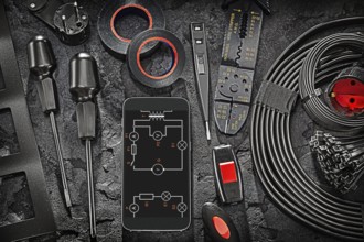 Big Black Electric Tools Set Smartphone Display With Blueprint On Abstract Stone Background