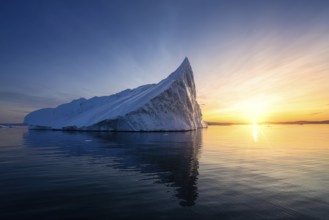 Floating glaciers in the rays of the setting sun at polar night