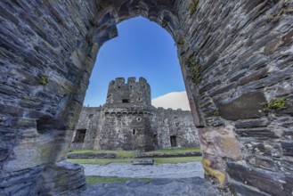 Conwy Castle, view through an arched opening in the castle wall to the tower of the medieval castle