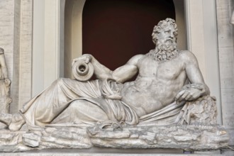 Vatican Museums, Vatican, Rome, Italy, Antique marble sculpture of a bearded man in a relaxed