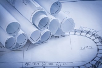 Pile of construction drawings building and architecture concept