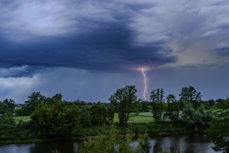 A single bolt of lightning strikes in a dramatic thunderstorm scene with dark clouds, Bogen, Lower