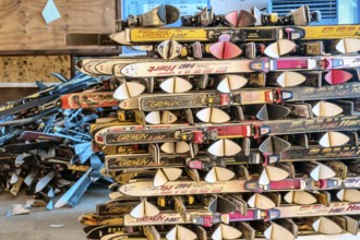 Goesan, South Korea. May 29, 2020: Snow skis from various manufactures stacked in rows in sunlit