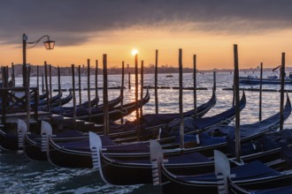 Dawn, cloudy atmosphere at sunrise, Venetian gondolas, Venice, UNESCO World Heritage Site, Veneto,