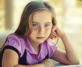Blond relaxed sad kid girl expression blue eyes portrait