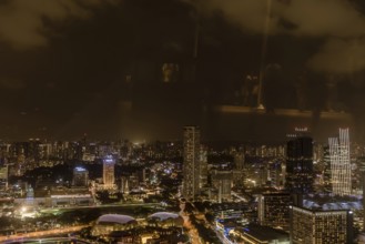 Singapore City, Singapore, January 23, 2019: Beautiful aerial night view of Marina Bay and the