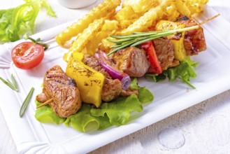 Shish kebab skewers with marinated ham meat paprika and red onion