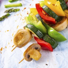 Vegetarian skewers white mushrooms, peppers and zucchini for barbecue
