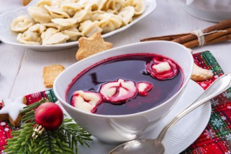 Red barzcz with uszka a polish christmas soup