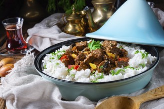 Tajin beef stew with rice, peppers and sesame seeds