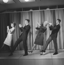 Dancing in the 1960s. The dance Hully Gully is being made popular and here are men and women