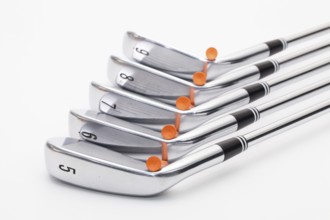 Titanium golf clubs on the white background