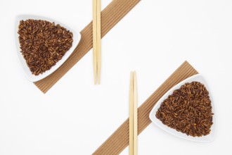 Top View Of White Sushi Plate With Rise And Chopsticks. Symmetry Food Design