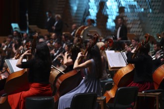 An orchestra is a large instrumental ensemble typical of classical music, which combines