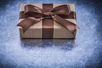 Packed gift boxes with brown ribbon horizontal version holidays concept