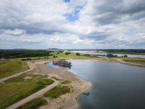 Gravel and sand extraction at the river Rhine using a gravel extractor