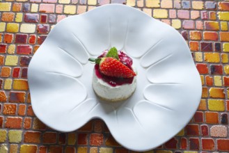 Cheesecake with cranberries sauce dessert