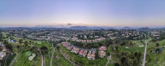 Aerial panoramic view of golf in upscale residential neighborhood during sunset, Rancho Bernardo,