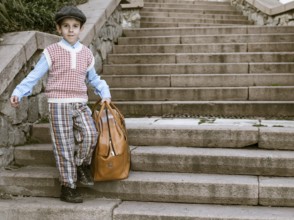 Exterior stairs and child with vintage bag. Vintage clothes style