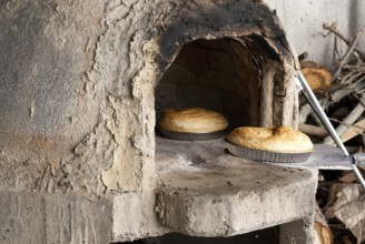 Fresh homemade bread cooked on a traditional clay oven. Home bakery