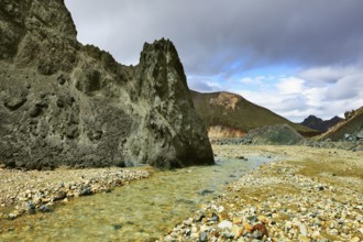 Green rock and creek in the gorge. National Park Landmannalaugar in Iceland