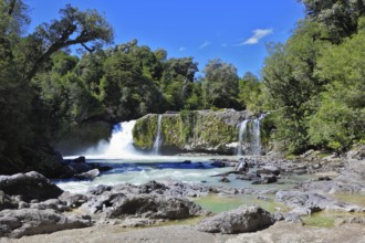 Picturesque cascading waterfall among rocks and forests